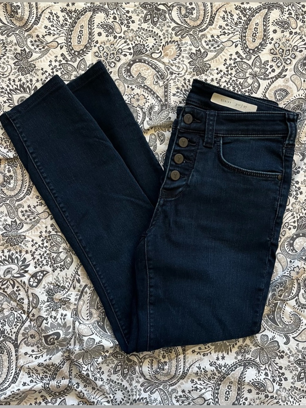 Dark wash high waisted skinny jeans with button fly